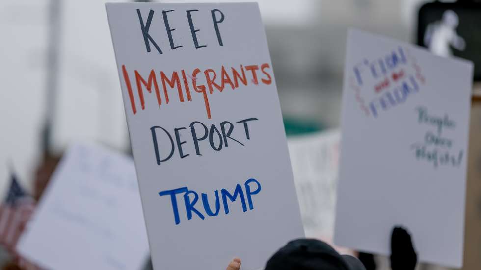 epa11899567 Demonstrators participate in a pro-democracy protest against recent Trump administration policies and actions outside the Georgia State Capitol in downtown Atlanta, Georgia, USA, 15 February 2025. The small group marched and chanted against US President Trump, Elon Musk, government worker firings, and mass immigration deportations.  EPA/ERIK S. LESSER