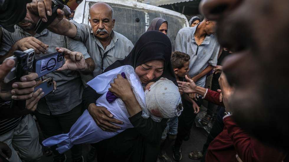 epa11658000 A Palestinian woman, grandmother of killed one-and-a-half-year old baby Yaman Al Zaneen, mourns while carrying his body during the funeral in Deir al Balah, central Gaza Strip, 14 October 2024. According to the Palestinian Ministry of Health, 23 people, including children, were killed after a school sheltering internally displaced Palestinians in Nuseirat camp was struck by an Israeli attack on 13 October. More than 42,200 Palestinians and over 1,400 Israelis have been killed, according to the Palestinian Health Ministry and the Israeli Army, Tsahal, since Hamas militants launched an attack against Israel from the Gaza Strip on 07 October 2023, and the Israeli operations in Gaza and the West Bank which followed it.  EPA/MOHAMMED SABER