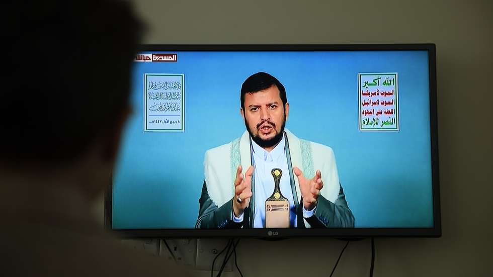 epa12340131 A person watches Houthi leader Abdul-Malik al-Houthi delivering a TV speech, three days after Israeli strikes killed senior Houthi officials, in Sana’a, Yemen, 31 August 2025. Houthi leader Abdul-Malik al-Houthi vowed to continue missile and drone attacks against Israel following the death of Houthi Prime Minister Ahmed Al-Rahawi and several other senior officials in Israeli strikes in Sana’a on 28 August 2025.  EPA/YAHYA ARHAB