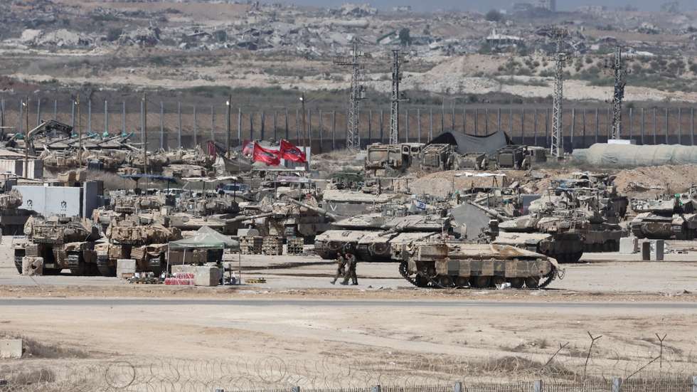 epa12345927 Israeli soldiers with military vehicles gather at a position near the border fence with the Gaza Strip, as seen from the Israeli side of the border, in southern Israel, 02 September 2025. Israel's military said it is stepping up logistical and operational preparations ahead of expanded combat operations and a large-scale mobilization of reservists.  EPA/ABIR SULTAN
