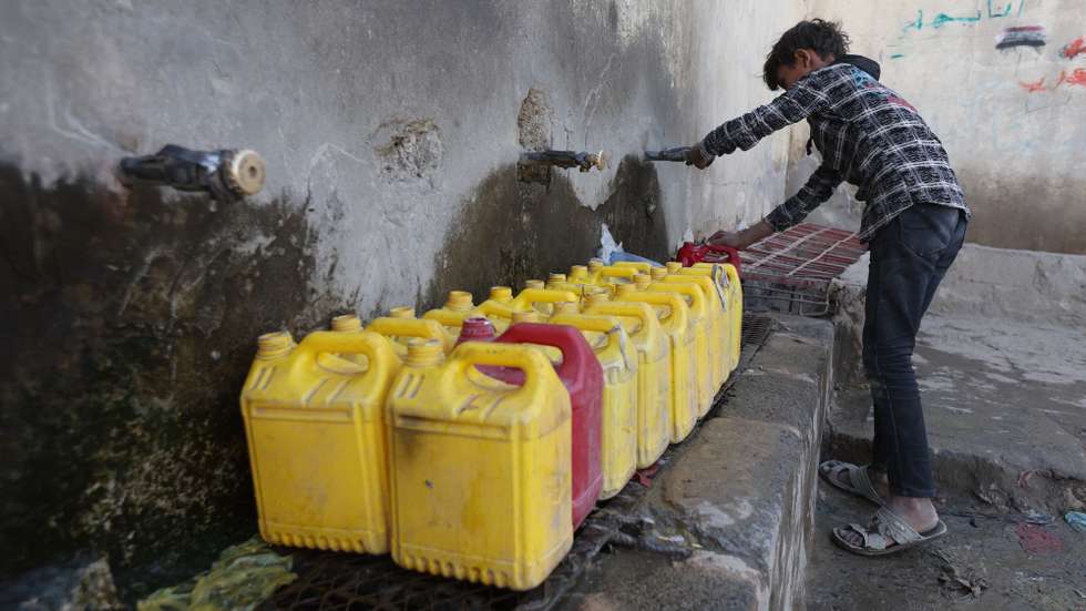 epa11746144 A boy fills jerrycans with water from a donated water pipe on the roadside in Sana'a, Yemen, 28 November 2024. Approximately 9.8 million children in Yemen are in urgent need of safe water, sanitation and hygiene since they are at risk of water borne diseases, including cholera, according to UNICEFâ€™s recent data. Yemenis, especially children, struggle each day to find enough water for cooking and washing as the local water pipe network reaches only 30 percent of the war-torn countryâ€™s 30 million-population who receive water once or twice a month, according to data from local water authorities.  EPA/YAHYA ARHAB