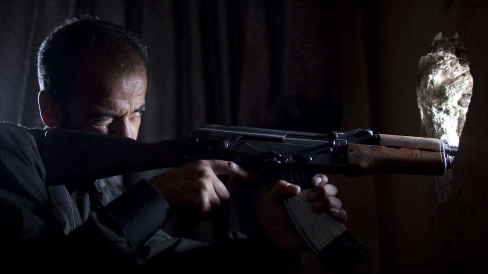 epa12241113 (FILE) - A Syrian rebel fighter aims his weapon towards regime positions at the Saif Al-Dawla front line in Aleppo, Syria, 19 September 2013 (reissued 16 July 2025). Bashar al-Assad assumed power at the age of 34, following the death of his father, Hafez al-Assad, in 2000. Bashar al-Assad's 25 years of rule profoundly marked Syria's political landscape, leaving a country marked by deep authoritarianism, sectarian division, institutional decay and a civil war recognized as one of the world's worst humanitarian crises.  EPA/JM Lopez *** Local Caption *** 51005779