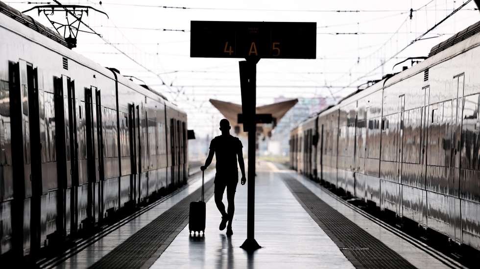 epaselect epa09499457 A traveler is seen at the train station in Valencia, Spain, on the second day of strike of train drivers, 01 October 2021. According to state-owned Renfe company that operates trains in Spain, more than a 60 per cent of the trains that should be working in minimal service are not in operation due to an 'injustified absence' by many employees.  EPA/Biel Alino