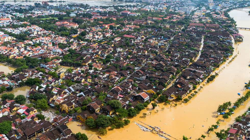epa12494614 An aerial photo shows flood waters surrounding streets and houses after heavy rain in Hoi An, Vietnam, 31 October 2025. Floods triggered by record rainfall killed at least ten people and left several others missing in central Vietnam, according to state media.  EPA/STRINGER