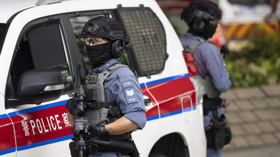 epa12328796 Armed members of the police counter terrorism response unit stand guard outside the West Kowloon Magistrates' Courts after today’s session of the closing arguments of Jimmy Lai's national security trial, in Hong Kong, China, 28 August 2025. Jimmy Lai’s trial closing arguments started last week in Hong Kong.  EPA/LEUNG MAN HEI