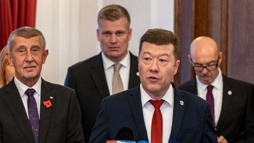 epa12500759 Freedom and Direct Democracy (SPD) party's chairman Tomio Okamura (2-R) talks to media after signing a new coalition government agreement with ANO (YES) movement's chairman Andrej Babis (L) and Motorists party's member Filip Turek (2-L) in Prague, Czech Republic, 03 November 2025. The parties have scheduled the signing ceremony for the first session of the new Chamber of Deputies. The parties plan to appoint a 16-member government, which will have a majority of 108 MPs in the lower house and be chaired by Andrej Babis.  EPA/MARTIN DIVISEK