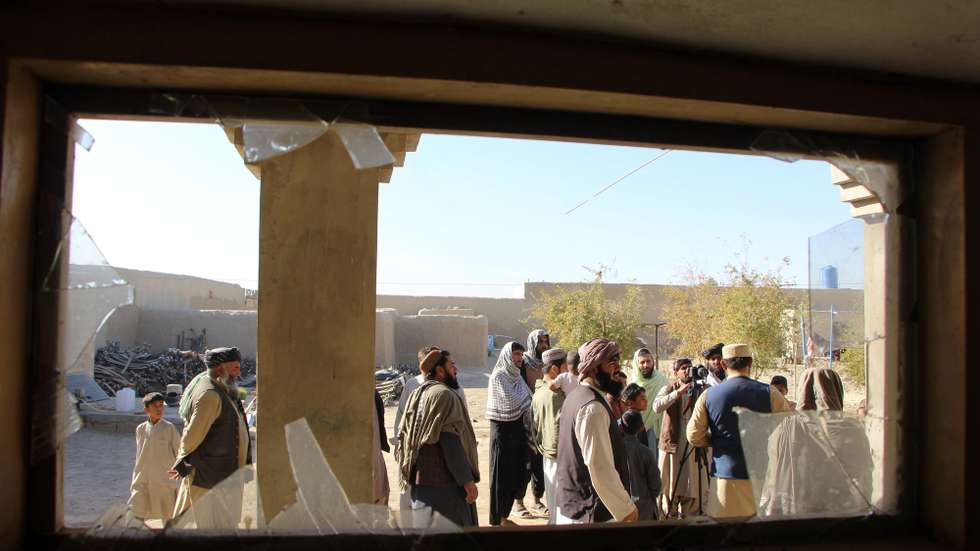 epa12510200 People stand by a house allegedly damaged by cross-border fire from Pakistan at the Pak-Afghan border in Spin Boldak, Afghanistan, 07 November 2025. Afghanistan's Taliban-led government on 06 November accused Pakistan of violating a ceasefire with fresh border attacks in Kandahar's Spin Boldak district. The two neighbours are holding peace talks in Istanbul mediated by Qatar and Turkey, after a ceasefire agreed on 19 October ended a week of deadly clashes between them.  EPA/QUDRATULLAH RAZWAN