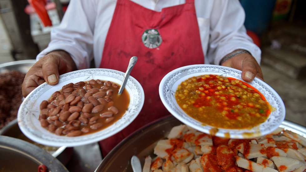 epa12455094 A Pakistani chef prepares meals in a restaurant a day before World Food Day in Peshawar, Pakistan, 15 October 2025. World Food Day is celebrated every year on 16 October to commemorate the founding of the Food and Agriculture Organization of the United Nations (FAO) in 1945. The day aims to raise public awareness about the plight of the world's hungry and malnourished and to encourage global action against hunger. The official theme for World Food Day 2025 is 'Hand in Hand for Better Foods and a Better Future.'  EPA/BILAWAL ARBAB