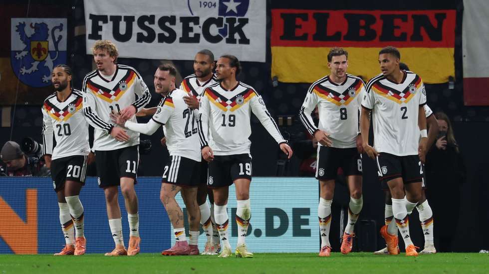 epa12532466 Ridle Baku of Germany celebrates with teammates after scoring the 5-0 during the FIFA World Cup 26 UEFA qualifier between Germany and Slovakia in Leipzig, Germany, 17 November 2025.  EPA/FILIP SINGER