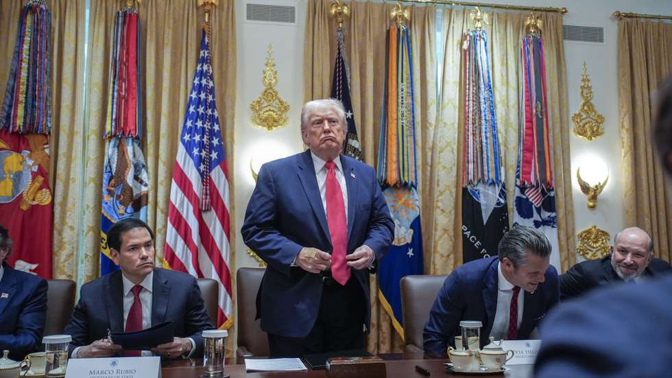 epa12565757 US President Donald J Trump (C) stands up to depart next to US Secretary of State Marco Rubio (L) and US Secretary of Defense Pete Hegseth (R) after holding a meeting with his Cabinet in the Cabinet Room of the White House in Washington, DC, USA, 02 December 2025.  EPA/YURI GRIPAS / POOL