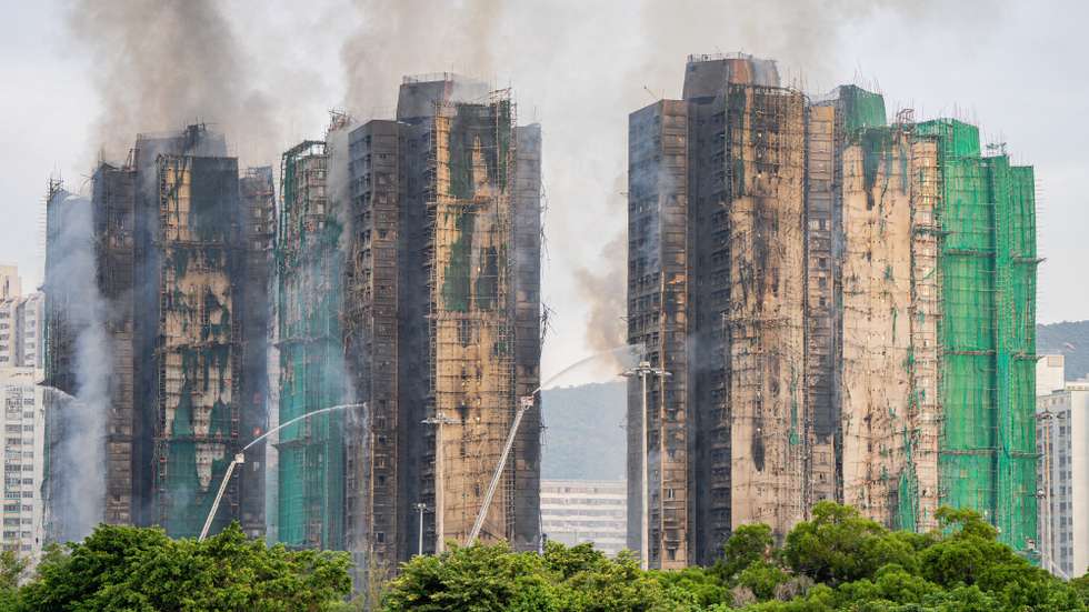 epa12551665 Smoke billows from an apartment fire in the Tai Po district of Hong Kong, China, 27 November 2025. The fire, which started on 26 November, has killed at least 44 people, and left 279 missing.  EPA/LEUNG MAN HEI
