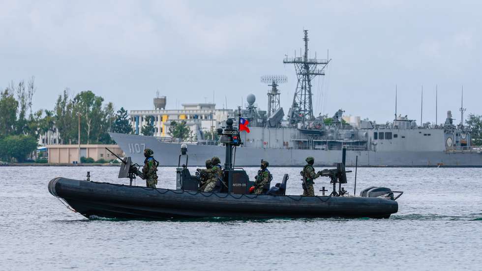 epa12236855 Taiwanese navy sailors patrol the perimeter during a drill inside a naval base as part of the annual Han Kuang military exercises, in Kaohsiung city, Taiwan, 14 July 2025. The Taiwanese Armed Forces began the annual Han Kuang exercises, large-scale military drills aimed at testing the troops' defensive capabilities in the event of a potential invasion by China. Han Kuang military exercises are scheduled between 09 to 18 July.  EPA/RITCHIE B. TONGO