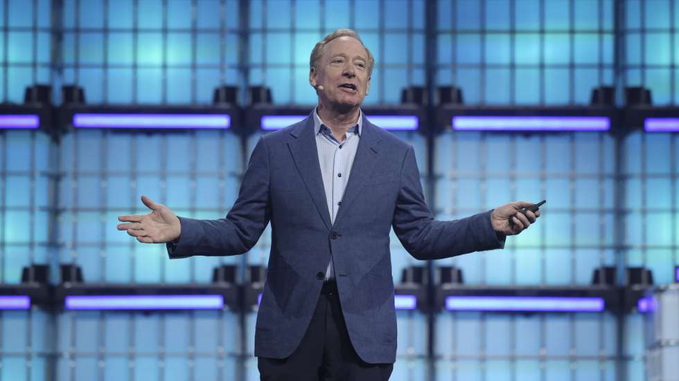 epa12518152 Microsoft President Brad Smith attends the conference "Extraordinary times" of the Web Summit Lisbon 2025, in Lisbon, Portugal, 11 November 2025. Web Summit 2025 is considered the largest technology conference in the world.  EPA/ANTONIO PEDRO SANTOS