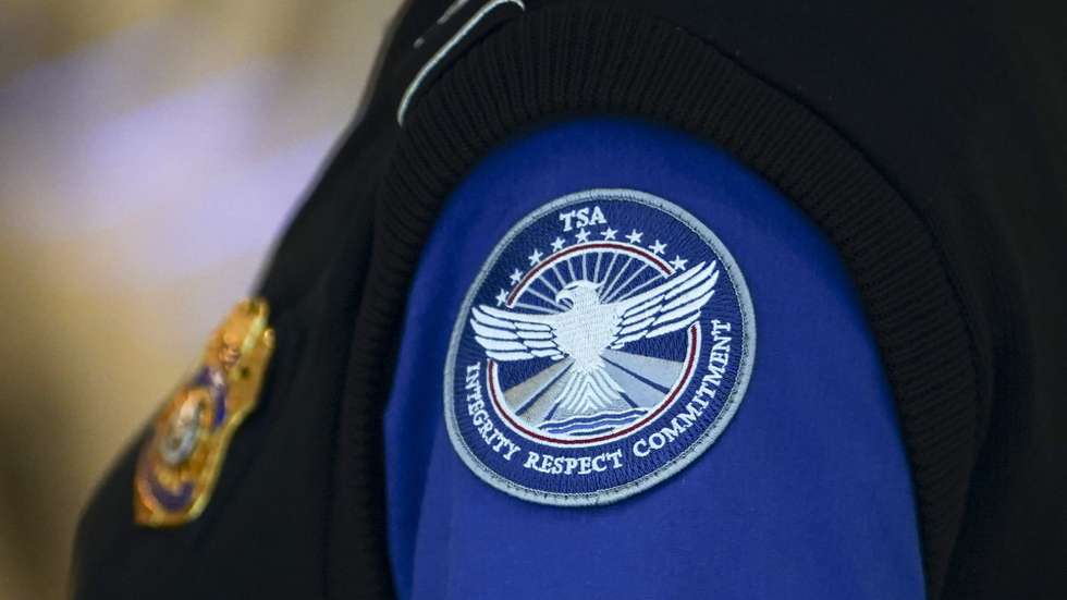 epa12420457 A Transportation Security Administration (TSA) employee at Ronald Reagan Washington National Airport in Arlington, Virginia, USA, 01 October 2025. The US government has shutdown after the US Senate failed to pass a funding bill last night. Federal departments including the TSA and air traffic controllers are expected to be affected during the shutdown.  EPA/WILL OLIVER