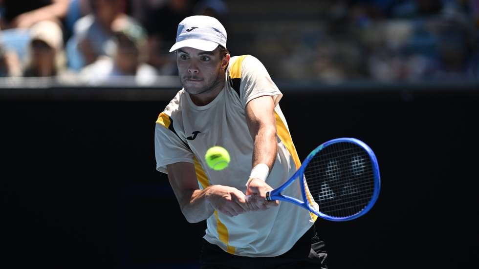 epa12666285 Jaime Faria of Portugal in action during his Men's Singles match against Andrey Rublev of Russia  on day 4 of the Australian Open tennis tournament at Margaret Court Arena in Melbourne, Australia, 21 January 2026.  EPA/LUKAS COCH  AUSTRALIA AND NEW ZEALAND OUT