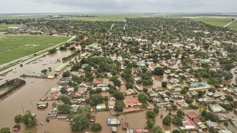epa12664693 An aerial view shows the flooded 03 February neighbourhood between the Maputo and Gaza regions, Maputo, Mozambique, 20 January 2026. Rescue efforts continue for hundreds of families cut off by flooding, with some taking refuge on rooftops, car roofs, or in treetops in southern Mozambique after days of near-continuous rain that has also forced dams, including some in neighbouring countries, to increase water releases.  EPA/LUISA NHANTUMBO