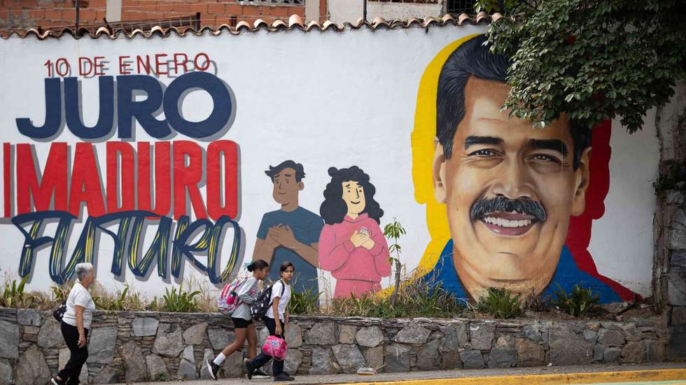 epa12701089 People walk past a mural of Venezuelan President Nicolas Maduro in Caracas, Venezuela, 02 February 2026. Chavismo marks 27 years in power in Venezuela, with its current leader, Nicolas Maduro, detained in the United States after US forces captured him nearly a month ago along with his wife, Congresswoman Cilia Flores, amid a series of US military attacks on Venezuelan soil.  EPA/RONALD PENA R