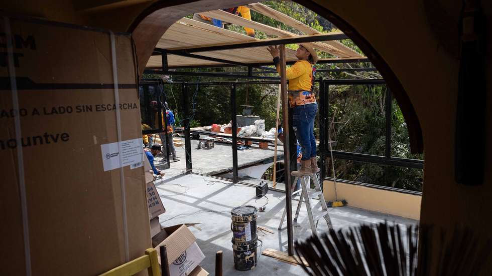 epa12700470 People work in a house damaged by an explosive device attack on 03 January in Caracas, Venezuela, 28 January 2026 (issued 02 February 2026). One month after the US military attack on its territory, Venezuela remains expectant about a future whose course is tied to the White House, with a Chavista regime undergoing a complete realignment without Nicolas Maduro at the helm and an opposition thus far relegated in a new scenario dominated by US President Donald Trump.  EPA/Ronald Pena R