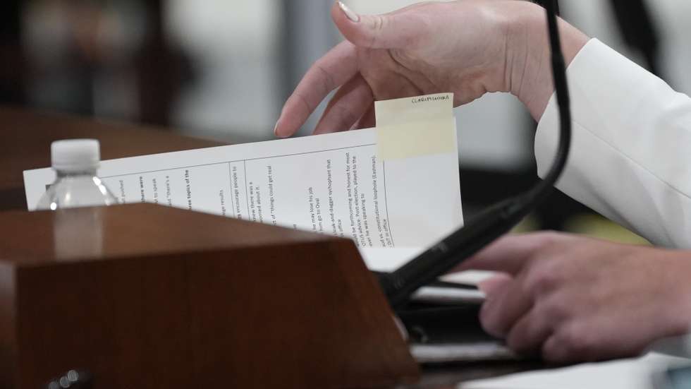 epa10039940 Cassidy Hutchinson, a former aide to White House Chief of Staff Mark Meadows, looks through her notes marked with a 'clarifications' during a public hearing of the House Select Committee to Investigate the January 6th Attack on the US Capitol, on Capitol Hill in Washington, DC, USA, 28 June 2022. Unlike several previous hearings, this hearing was announced only 24 hours in advance.  EPA/ERIC LEE
