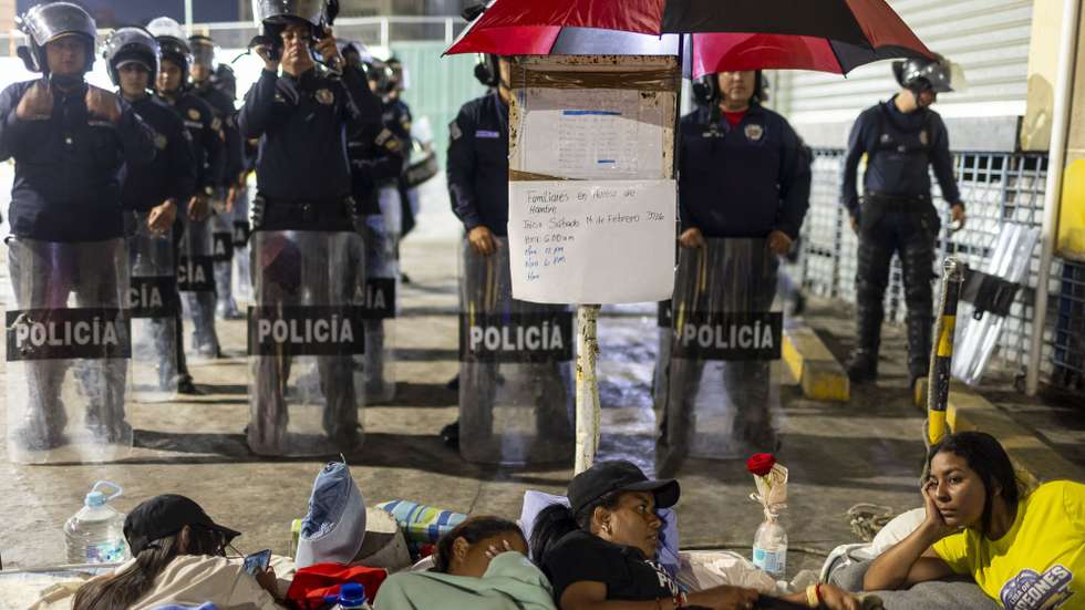 epa12745274 Relatives of political prisoners remain on hunger strike outside the Bolivarian National Police headquarters known as Zone 7 in Caracas, Venezuela, 15 February 2026. Two of the ten women taking part in the protest have experienced health problems since beginning the strike on Saturday.  EPA/Miguel Gutierrez