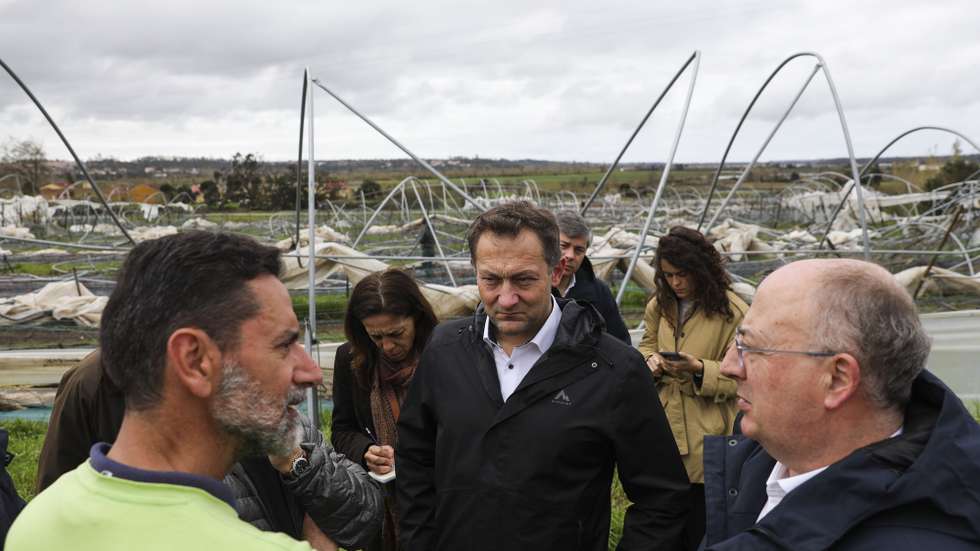 epa12750878 European Commissioner for Agriculture and Food, Christophe Hansen (C), and Portuguese Minister of Agriculture and Sea, Jose Manuel Fernandes (R), during a visit to farms affected by storms that hit Portugal in the areas of Leiria and Pombal, in Portugal, 17 February 2026.  EPA/PAULO CUNHA