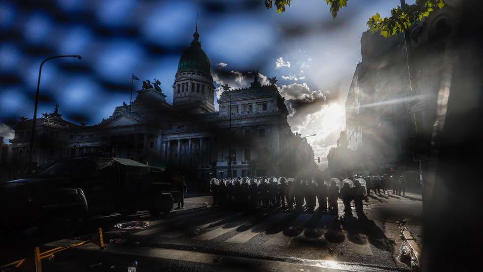 epa12760166 Members of the Argentine Police stand in formation during clashes with protesters at a demonstration against labor reform proposed by Argentine President Javier Milei in Buenos Aires, Argentina, 19 February 2026.  EPA/JUAN IGNACIO RONCORONI