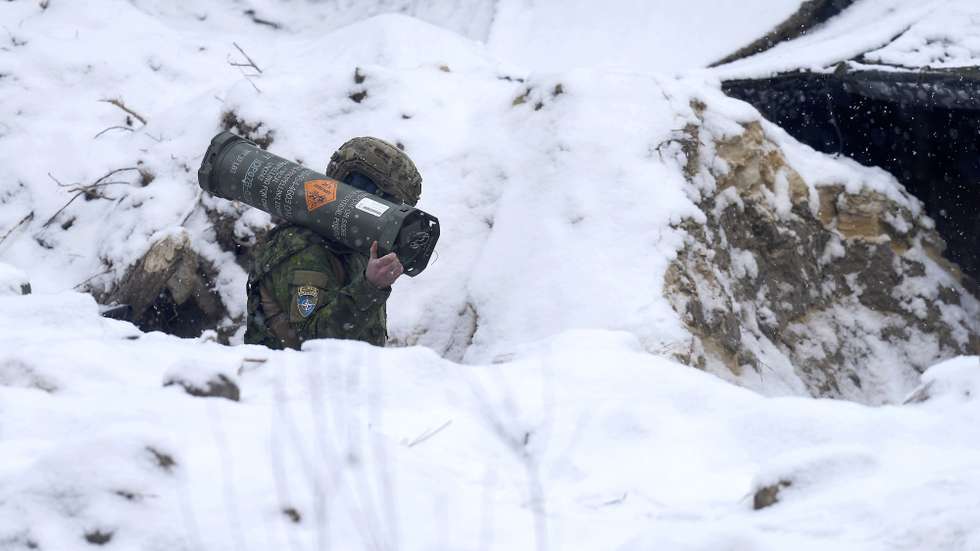 epa12757154 A member of the Canadian-led Multinational Artillery Battalion attends the NATO 'Striking Thunder' artillery shooting exercise at the Adazi Training Area in Latvia, 19 February 2026. The aim of the exercise is to improve the interoperability and precision of fire support capabilities between the Canadian-led Multinational Artillery Battalion and allied units.  EPA/VALDA KALNINA