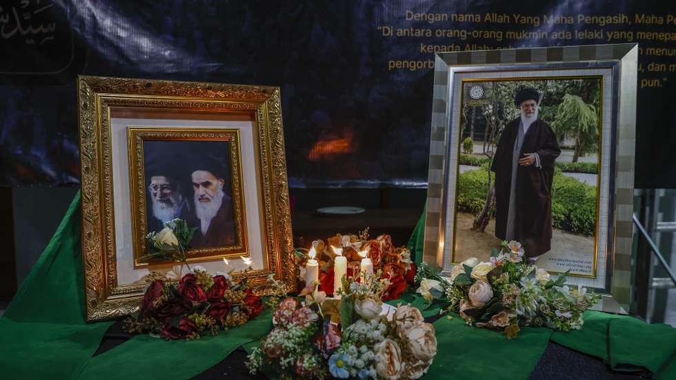 epa12790140 Flowers lay near the portraits of the late Iranian Supreme Leader Ayatollah Ali Khamenei during a prayer in Jakarta, Indonesia, 02 March 2026. Iranian Supreme Leader Ayatollah Ali Khamenei was killed in an airstrike during a joint USA-Israeli military campaign that began on 28 February 2026.  EPA/MAST IRHAM