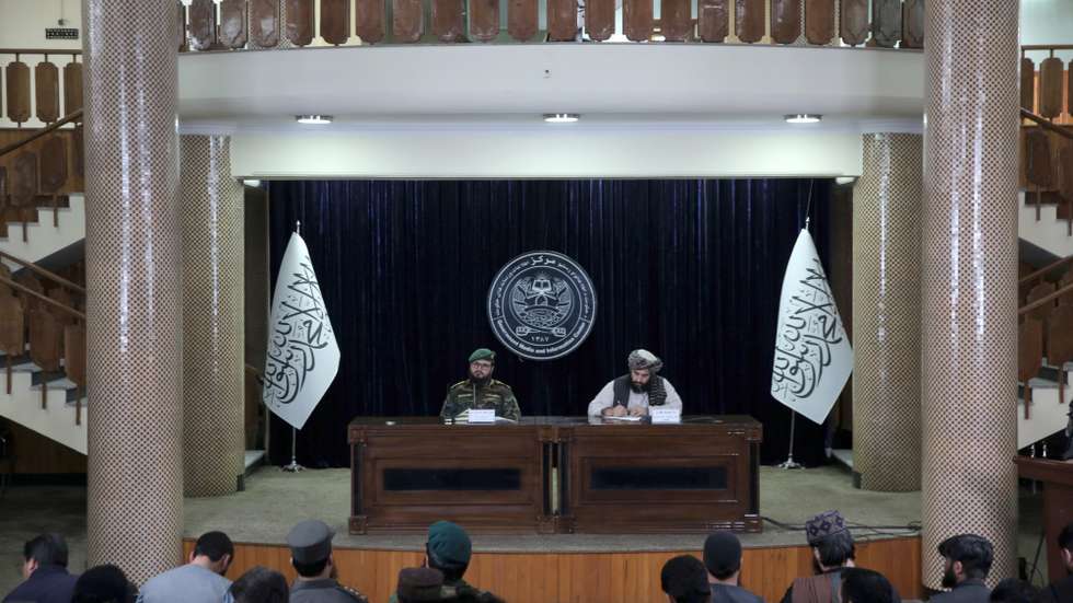 epa12791520 Spokesperson of Ministry of National Defense, Mufti Enayatullah Khwarazmi (L) and Deputy Spokesperson Mullah Hamdullah Fitrat (R) talk during a press conference in Kabul, Afghanistan, 03 March 2026. The deputy spokesman for the Islamic Emirate, Mullah Hamdullah Fitrat said that 110 civilians were killed and 123 injured in what he described as attacks by the Pakistani military in Afghanistan. He added that about 8,400 families have been displaced and that financial losses have been reported among the general population.  EPA/SAMIULLAH POPAL