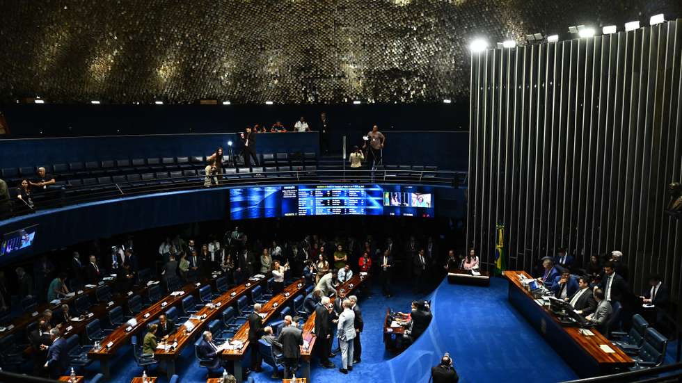 epa12599789 Brazilian senators attend a Senate session in Brasilia, Brazil, 17 December 2025. The Brazilian Senate approved a bill seeking to reduce the sentences of former president Jair Bolsonaro, who was sentenced to 27 years in prison, and other participants in the coup plot that followed the 2022 elections.  EPA/ANDRE BORGES