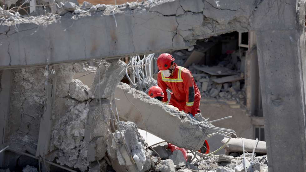 epa12853988 Iranian firefighters work on a damaged residential building in southern Tehran, Iran, 27 March 2026. A joint Israeli and US military operation continues to target multiple locations across Iran since the early hours of 28 February 2026.  EPA/ABEDIN TAHERKENAREH