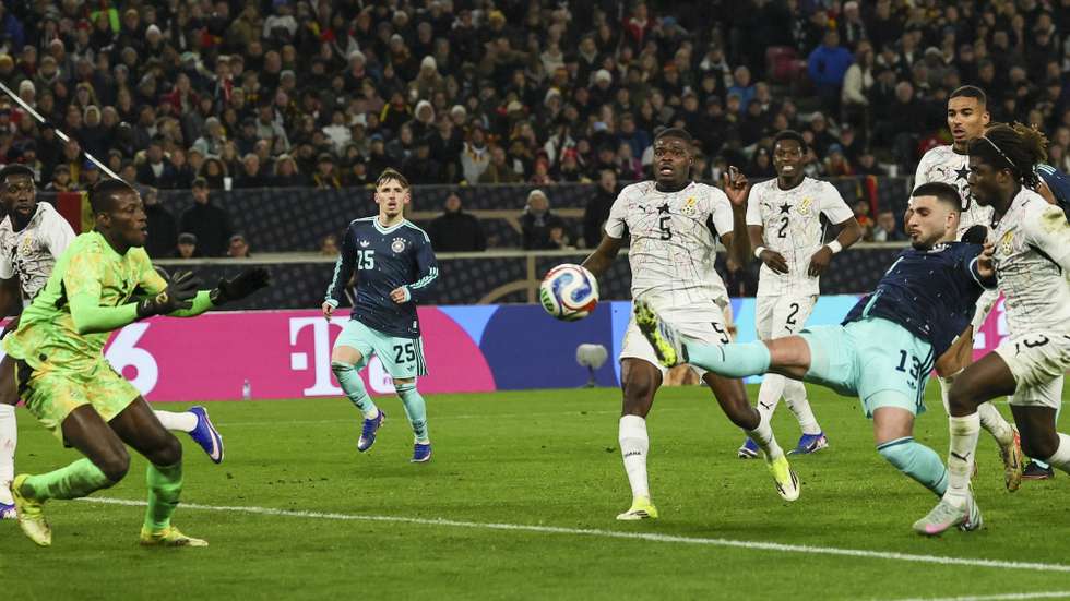 epa12860837 Deniz Undav of Germany (2R) in action against goalkeeper Benjamin Asare of Ghana (L) ahead scoring 2-1 during the friendly soccer match between Germany and Ghana in Stuttgart, Germany, 30 March 2026.  EPA/RONALD WITTEK