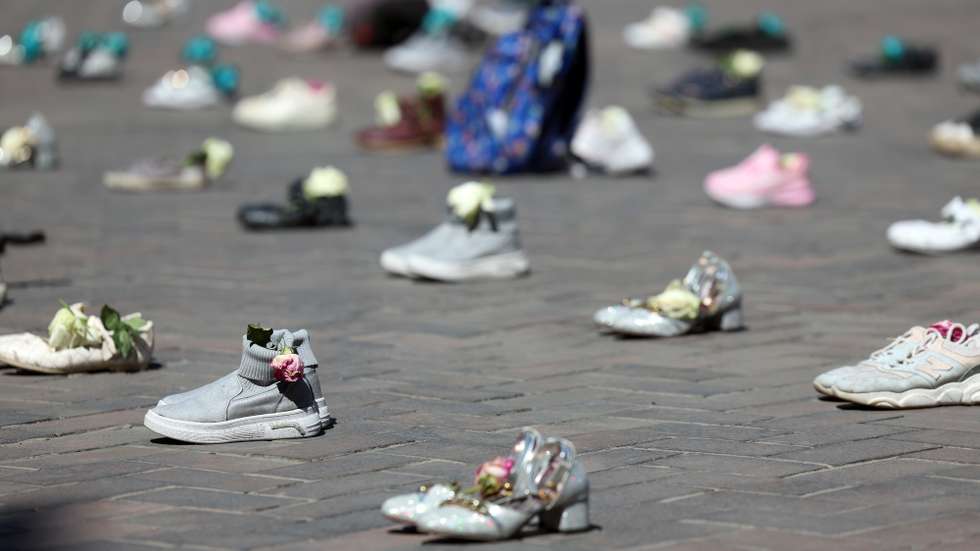 epa12905970 Symbolic belongings of Minab schoolgirls killed in a US airstrike laid on the floor at Valiasr Square in Tehran, Iran, 22 April 2026. US President Donald Trump announced that the ceasefire between the US-Iran has been extended.  EPA/ABEDIN TAHERKENAREH