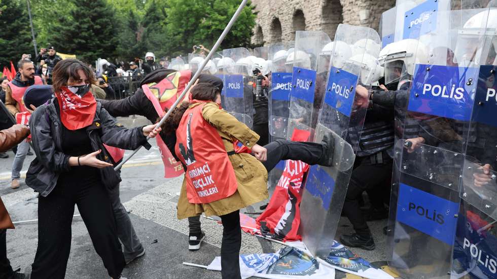 epa11311990 Protesters clash with riot police as they attempt to reach Taksim Square to celebrate the International Labor Day in Istanbul, Turkey, 01 May 2024. Thousands of protesters, including members of the main labor unions and leftist groups, gathered for a rally to reach Istanbul's Taksim Square as Turkish police sealed off the central square to prevent May Day demonstrations. The security measures came a day after Interior Minister Yerlikaya said authorities had designated 40 areas for May Day celebrations, excluding Taksim Square.  EPA/TOLGA BOZOGLU