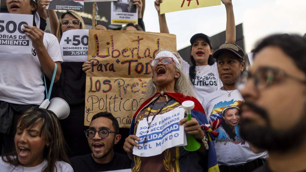 epaselect epa12931023 People hold signs during a demonstration calling for the release of political prisoners in Caracas, Venezuela, 03 May 2026. Venezuelans gathered in various cities across the country to demand the release of political prisoners, following a call to action issued by opposition leader and 2025 Nobel Peace Prize laureate Maria Corina Machado.  EPA/Miguel Gutierrez