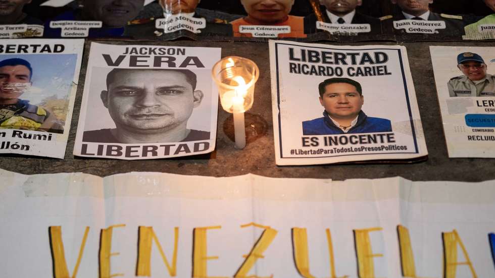 epa12942773 A photograph shows posters of political prisoners during a vigil in support of the late Víctor Hugo Quero, who died last year while in state custody, organized by relatives of detainees, in Caracas, Venezuela, 08 May 2026.  EPA/Ronald Pena R