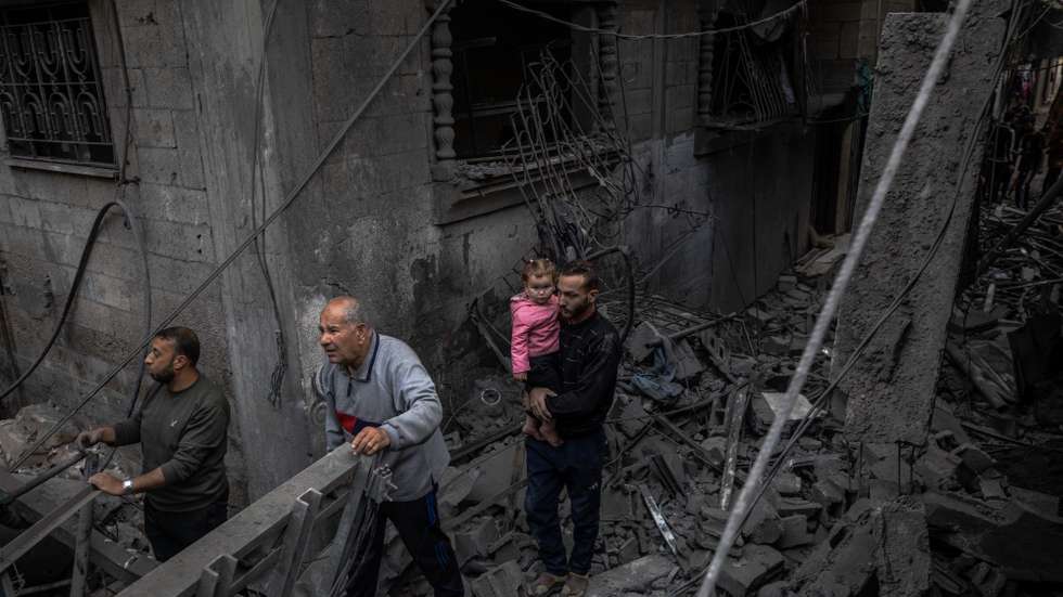 epa12942851 Palestinians inspect the ruins of their destroyed homes after an Israeli airstrike in the Al-Shati refugee camp, west of Gaza City, Gaza Strip, 09 May 2026. The overnight attack targeted a building following Israeli army warnings for residents to evacuate immediately.  EPA/MOHAMMED SABER