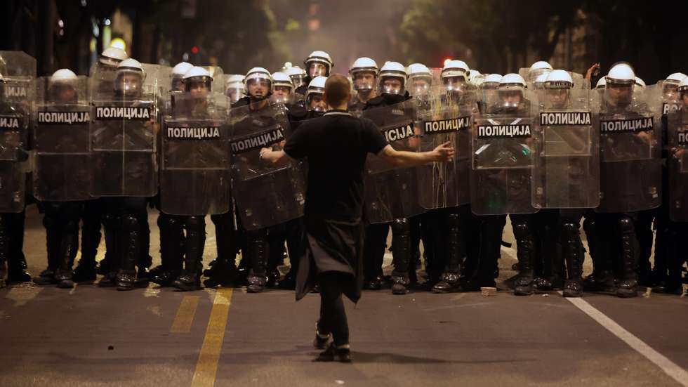 epa12988353 A protester hackles riot police officers as they take positions after a mass student-led anti-government rally in Belgrade, Serbia, 23 May 2026. Thousands gathered to ramp up pressure on the government and demand early parliamentary elections. The political movement originally erupted across the country following the November 2024 canopy collapse at the Novi Sad railway station that killed 16 people.  EPA/ANDREJ CUKIC