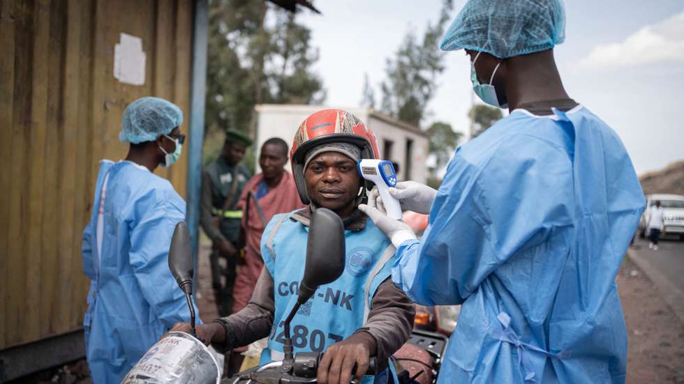 epaselect epa12997409 Health workers in protective gowns and masks check locals’ temperature as a preventive measure against Ebola in Kanyaruchinya, near Goma, North Kivu, Democratic Republic of Congo, 27 May 2026. The World Health Organization (WHO) has declared the Ebola outbreak, caused by the Bundibugyo virus, in the Democratic Republic of the Congo a public health emergency of international concern.  EPA/MARIE JEANNE MUNYERENKANA