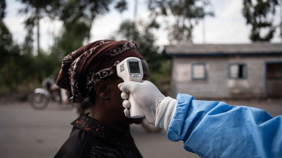 epaselect epa12997411 A health worker in a protective gown and mask checks locals’ temperature as a preventive measure against Ebola in Kanyaruchinya, near Goma, North Kivu, Democratic Republic of Congo, 27 May 2026. The World Health Organization (WHO) has declared the Ebola outbreak, caused by the Bundibugyo virus, in the Democratic Republic of the Congo a public health emergency of international concern.  EPA/MARIE JEANNE MUNYERENKANA