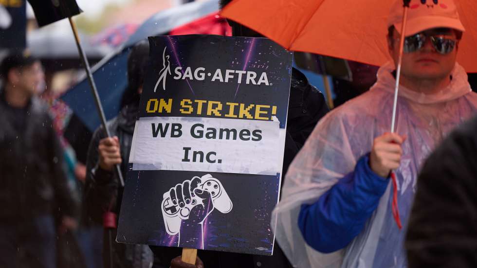 epa11943237 Members of SAG-AFTRA (Screen Actors Guild-American Federation of Television and Radio Artists) hold a picket outside WB Games Inc. in Burbank, California, USA, 05 March 2025. Members of SAG-AFTRA have been on strike since July 2024 against video game companies that signed the Interactive Media Agreement over AI protections for voice and motion performers.  EPA/ALLISON DINNER