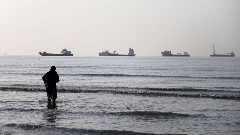 epa13009259 A handout photo made available by Isna News Agency shows an Iranian woman watching cargo ships stuck in the Strait of Hormuz, along the coast of Bandar Abbas, in southern Iran, 01 June 2026. According to Iranian state media, the military's central command warned all vessels to secure Islamic Revolution Guards Corps (IRGC) Navy clearance to pass through the strait or face maritime security risks.  EPA/AMIRHOSSEIN KHORGOOEI/ ISNA NEWS AGENCY HANDOUT RESTRICTIONS: NO Access Israel Media/Persian Language TV Stations Outside Iran/Strictly No Access BBC Persian/VOA Persian/Manoto TV/Iran International TV. (As mandated by Iran's Directorate General for Foreign Media) -- HANDOUT EDITORIAL USE ONLY/NO SALES