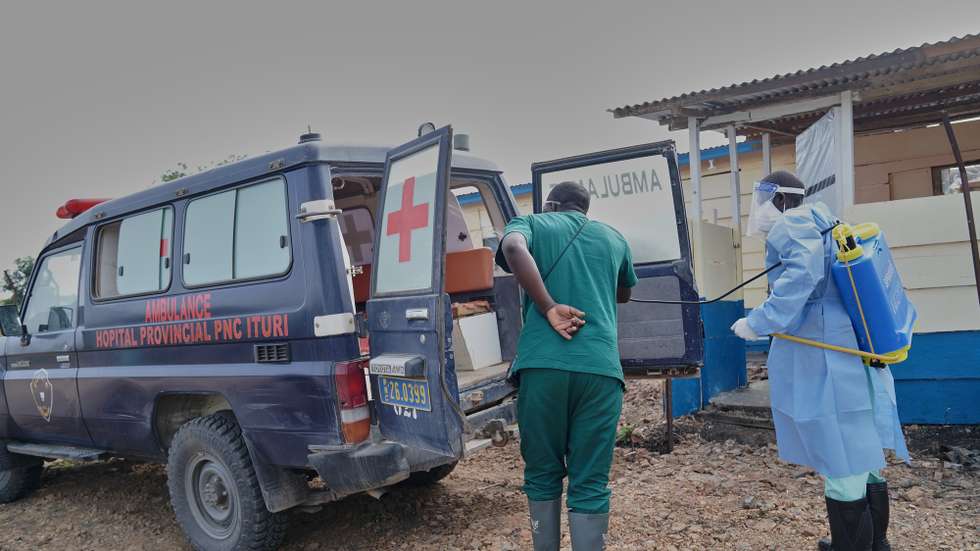 epaselect epa13027153 Medical staff disinfect an ambulance used to carry people infected with Ebola at the Rwampara Hospital in Rwanpara, Ituri, Democratic Republic of the Congo, 09 June 2026. The outbreak is caused by the Bundibugyo strain of the Ebola virus, for which there is no treatment, although three vaccines are in development.  EPA/DIEUDONNE DIROLE