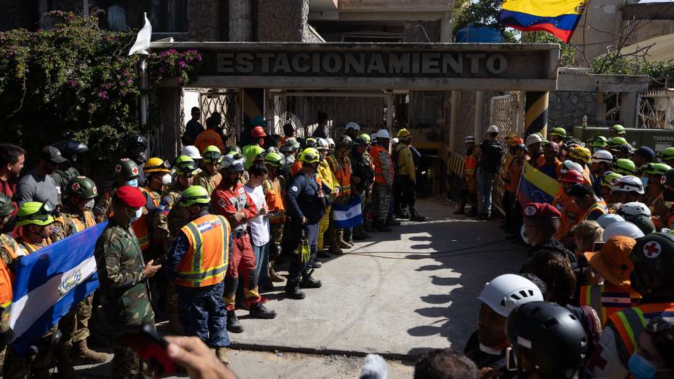epa13080368 Rescue workers operate at the scene where they rescued a survivor who was trapped for eight days after an earthquake in Catia La Mar, Venezuela, 02 July 2026, following a nearly 72-hour rescue operation. According to Venezuela's National Assembly president Jorge Rodriguez, at least 2,295 people died and 11,267 have been injured after two back-to-back earthquakes struck the country on 24 June.  EPA/RONALD PENA R