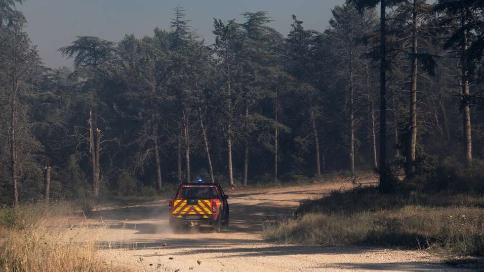 epa13081207 Firefighters work to extinguish a wildfire burning near Sainte-Valiere, Aude department, southern France, 02 July 2026. A large wildfire has been raging in southern France since 01 July, forcing scores of people to be evacuated, emergency services said.  EPA/CHLOE REULET