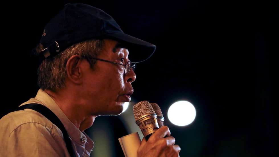 epa08465303 Lam Wing Kee, a former Hong Kong publisher speaks to the crowd as he join a vigil during the Commemoration of the 31th anniversary of the 1989 Tiananmen Massacre, in Taipei, Taiwan, 04 June 2020. In the early hours of 04 June 1989, Chinese troops cracked down on student protesters at Tiananmen Square in Beijing, leaving many students killed or injured.  EPA/RITCHIE B. TONGO