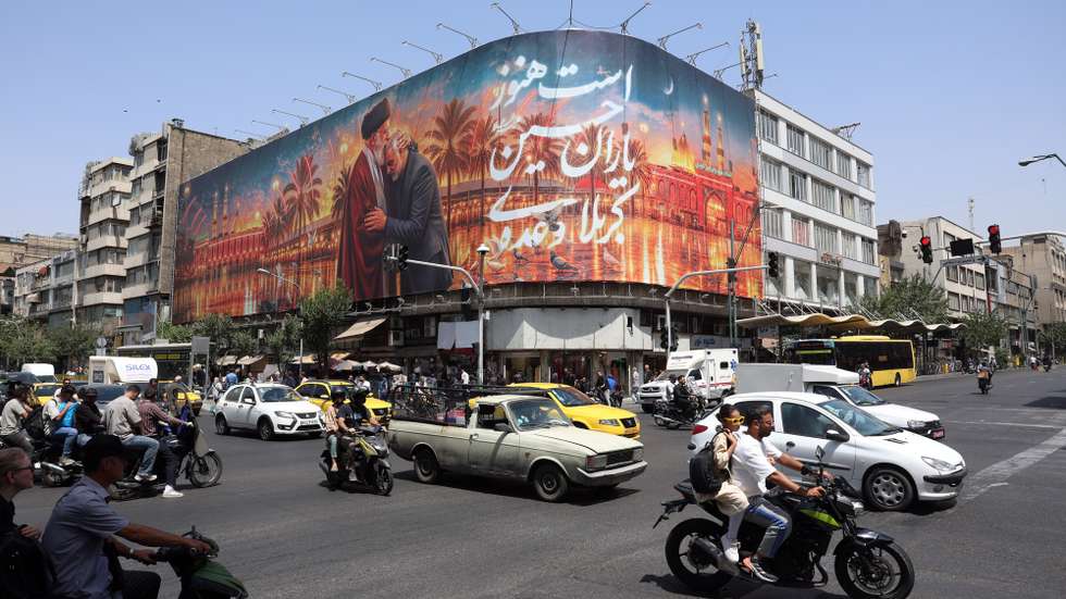 epa13071939 Iranians drive past a billboard featuring a picture of Iran's late Supreme Leader Ayatollah Ali Khamenei ahead of his funeral in Tehran, Iran, 29 June 2026. Iran is set to hold a multi-day mass funeral for the late supreme leader, amid heightened regional tensions following recent exchanges of fire between Iran and the US despite a recently signed agreement.  EPA/ABEDIN TAHERKENAREH RESTRICTIONS: NO Access Israel Media/Persian Language TV Stations Outside Iran/Strictly No Access BBC Persian/VOA Persian/Manoto TV/Iran International TV. (As mandated by Iran's Directorate General for Foreign Media) --