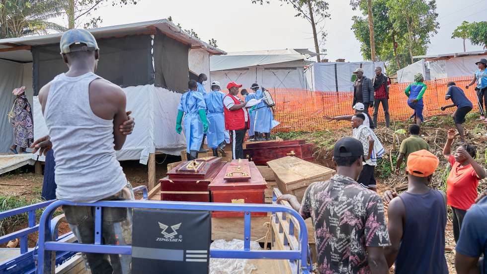 epa13075392 Families of Ebola victims claim their bodies from the hospital in Mongbwalu, Ituri, Democratic Republic of Congo, 26 June 2026 (issued 30 June 2026). Mongbwalu in Ituri, a town situated in the eastern Democratic Republic of the Congo, is where the Bundibugyo Ebola virus outbreak is believed to have started. Ituri is the most affected province, with 1,165 confirmed cases from 23 health zones, according to the country's Ministry of Health.  EPA/DIEUDONNE DIROLE