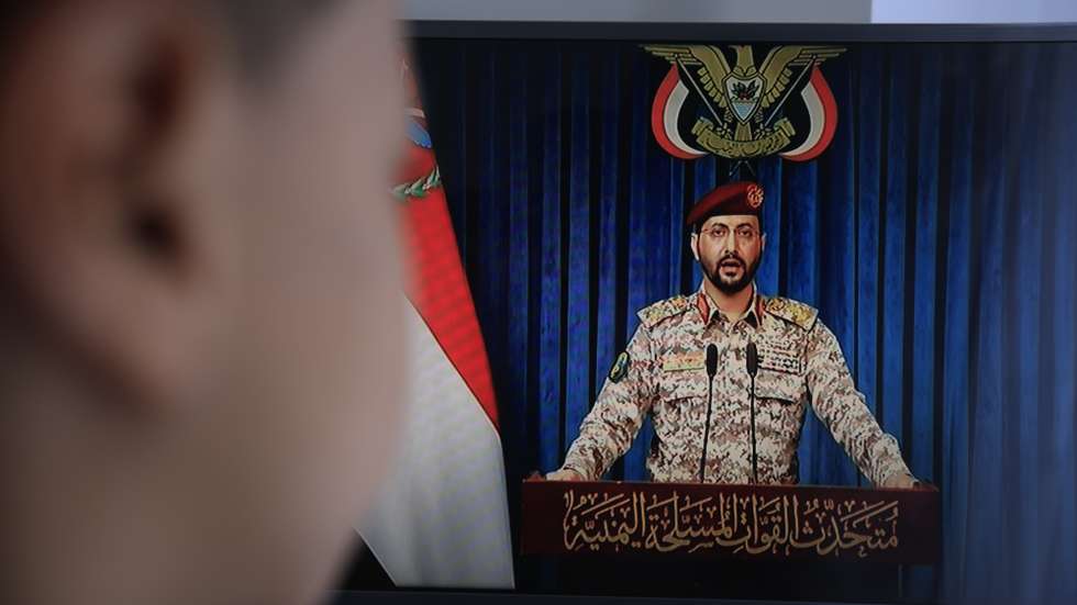 epa13122948 A person watches Houthi military spokesman Yahya Sarea deliver a televised statement in Sana'a, Yemen, 20 July 2026. Yemen's Houthis announced a maritime embargo against Saudi Arabia amid escalating tensions following the bombing of Sana'a airport on 13 July, according to a statement by Houthi military spokesman Yahya Sarea.  EPA/YAHYA ARHAB