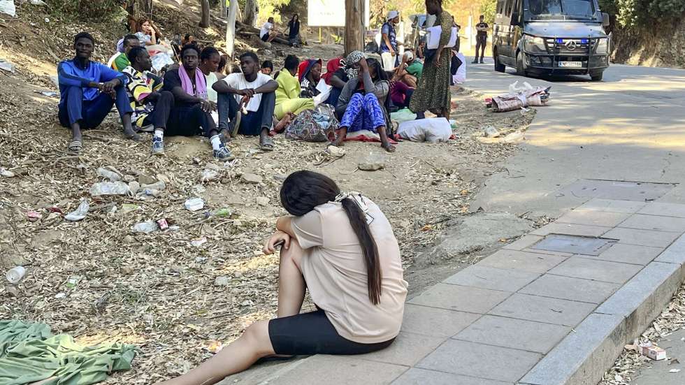 epa13151317 Young migrants wait to enter the Temporary Immigrant Accommodation Centre (CETI) in Ceuta, Spain, 05 August 2026, after entering the Spanish enclave on 30 July during a mass crossing at the border breakwater.  EPA/Reduan